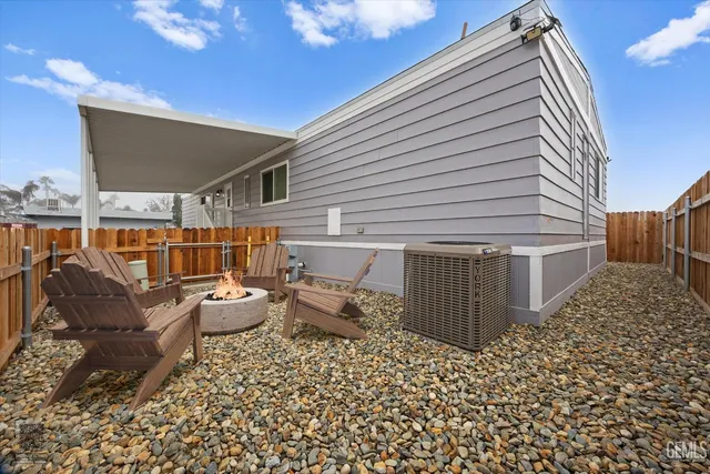 a kitchen with wooden cabinets and stainless steel appliances