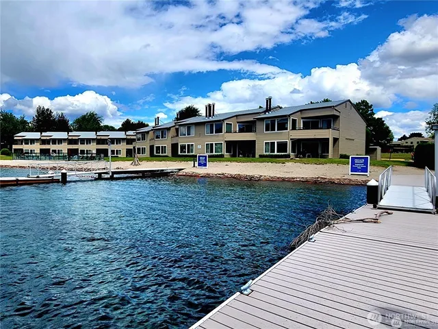 a view of a big yard with table and chairs