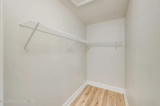 a view of a room with racks on the wall