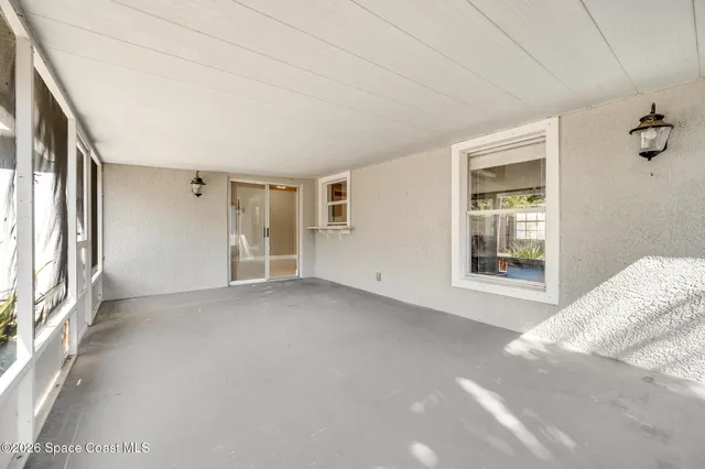 a view of an empty room and window