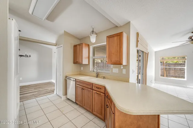 a large kitchen with kitchen island a sink stainless steel appliances and cabinets