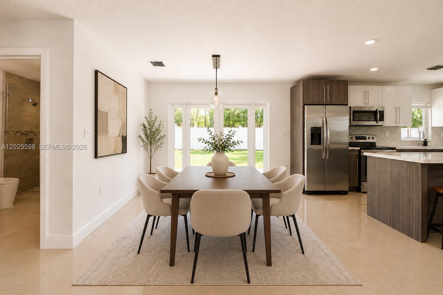 9421 Southwest 150th Street Miami, FL 33176 - Photo 6 of 31 a view of a dining room with furniture window and outside view