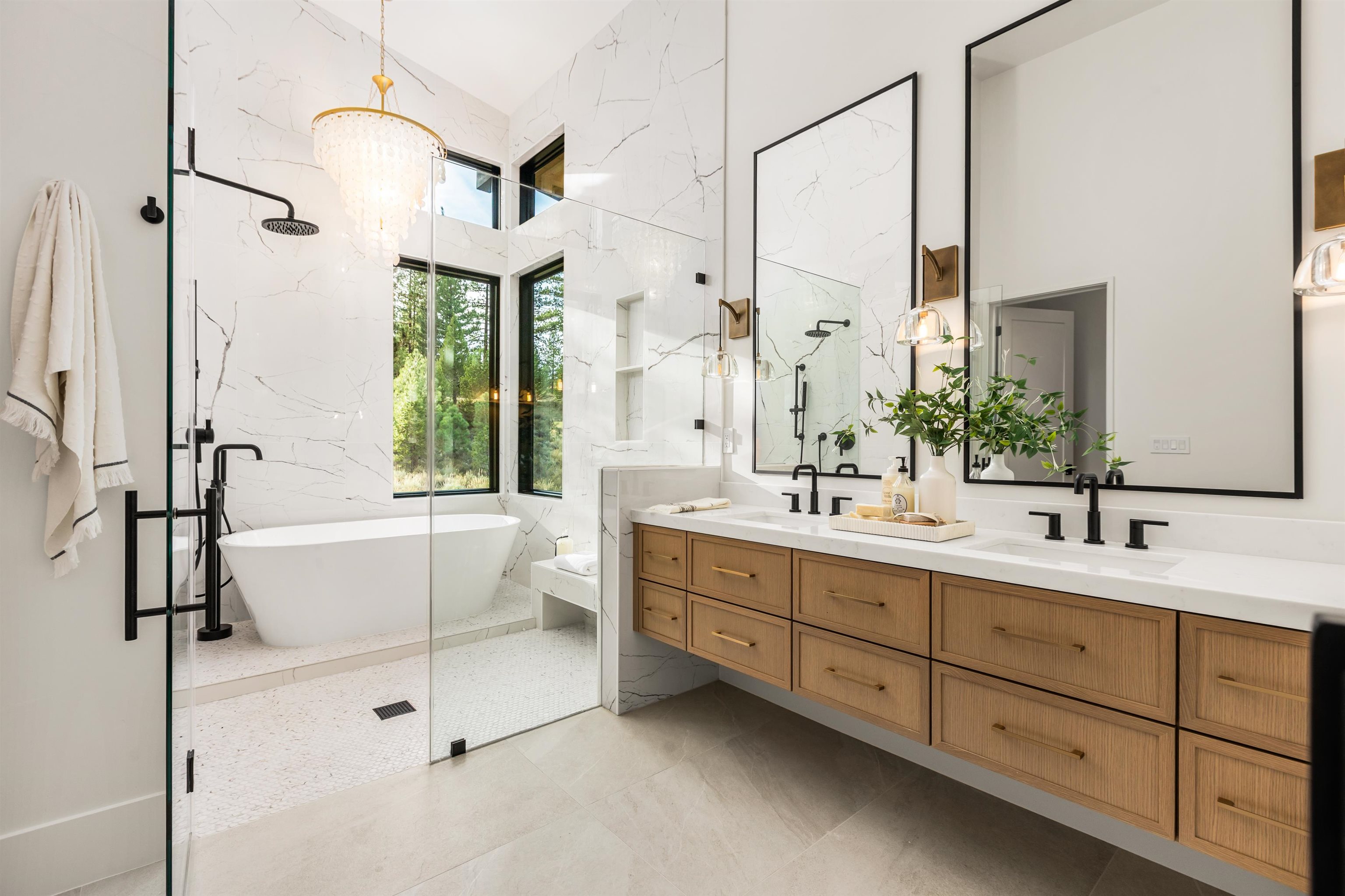 11051 Ghirard Road Truckee, CA 96161 - Photo 11 of 23 a bathroom with a double vanity sink toilet mirror and bathtub