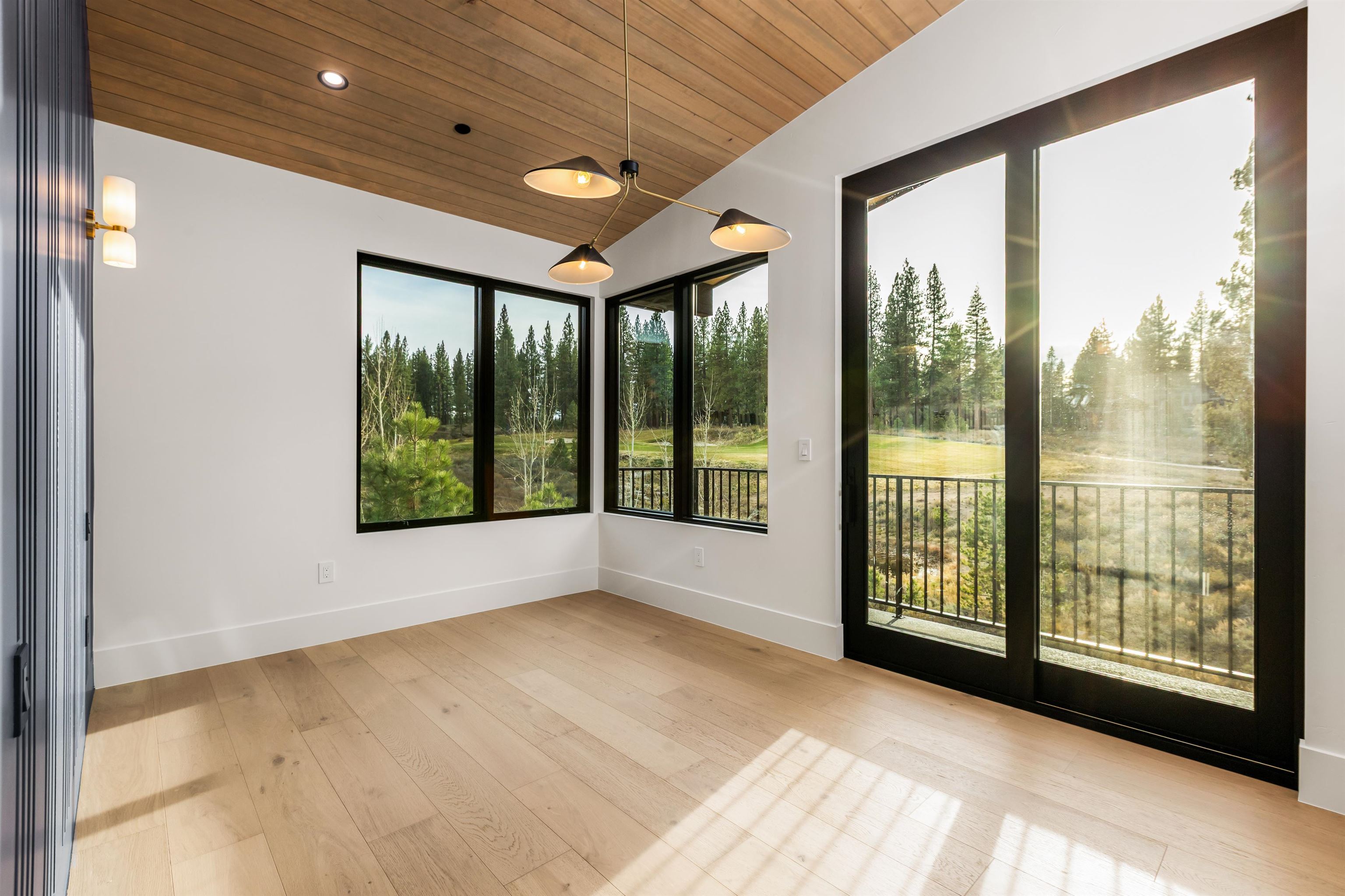 11051 Ghirard Road Truckee, CA 96161 - Photo 21 of 23 a view of an empty room with wooden floor and a window