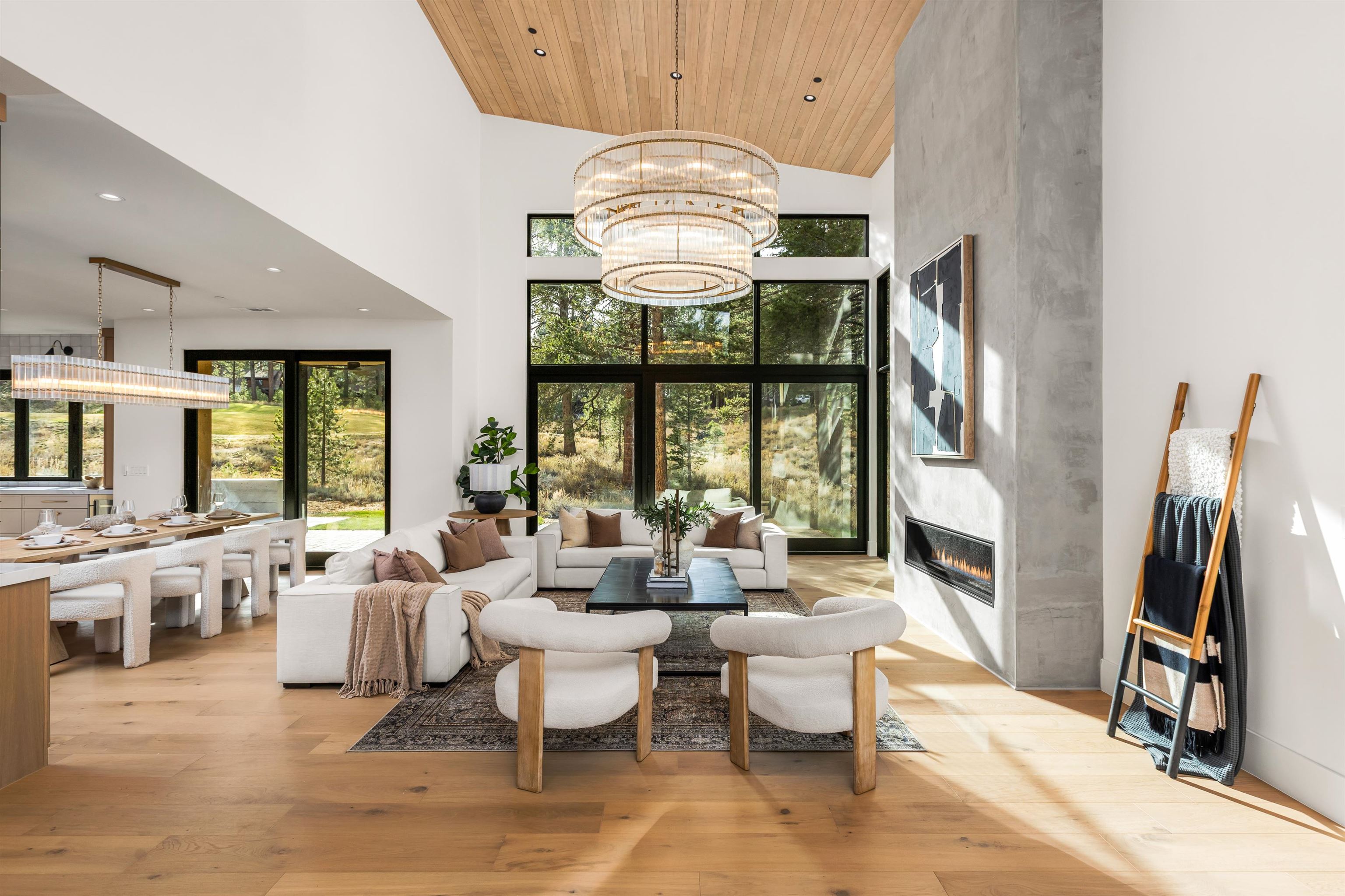 11051 Ghirard Road Truckee, CA 96161 - Photo 5 of 23 a very nice looking living room with a large window and chandelier