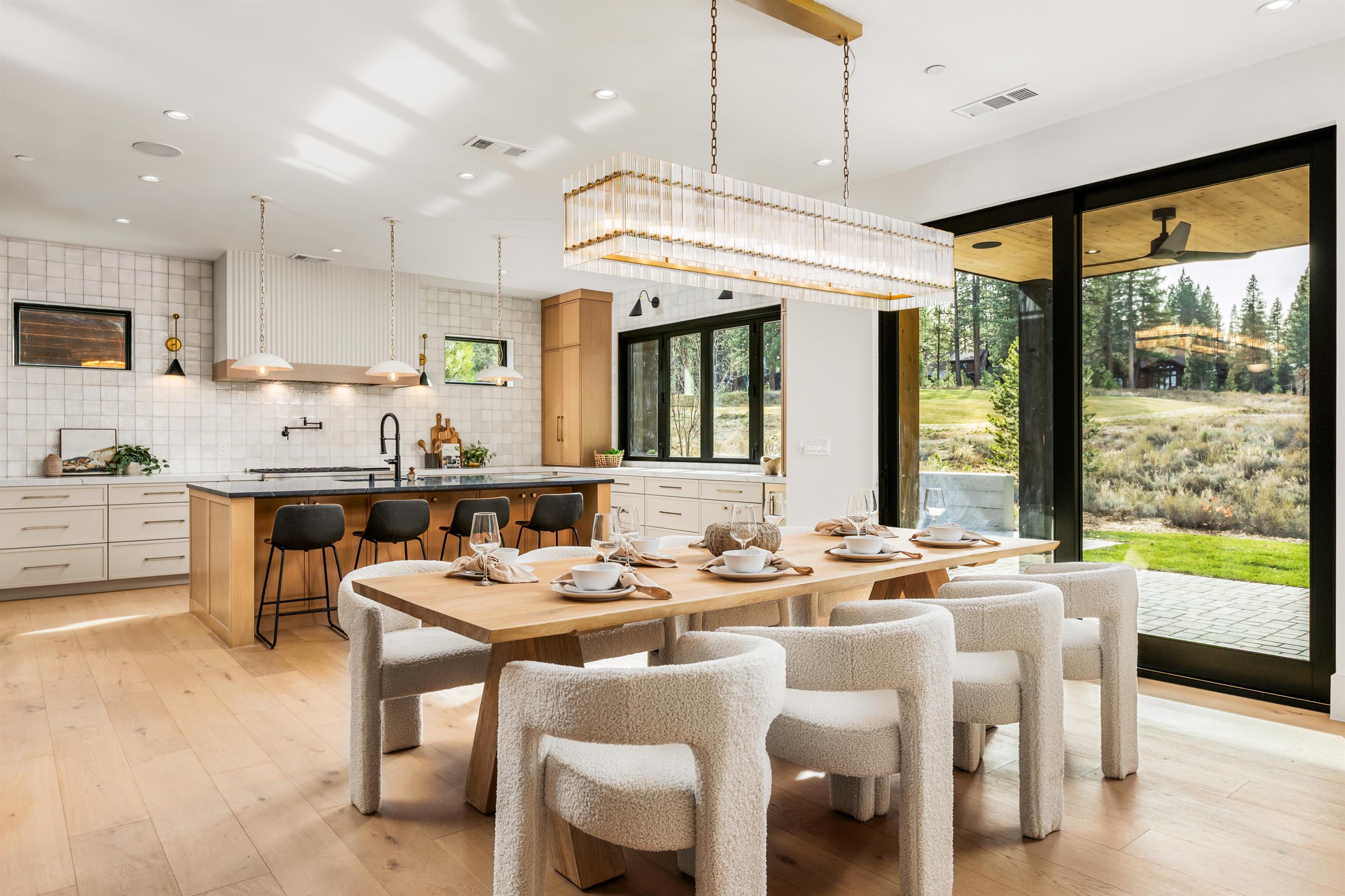 11051 Ghirard Road Truckee, CA 96161 - Photo 6 of 23 a view of a dining room with furniture window and outside view