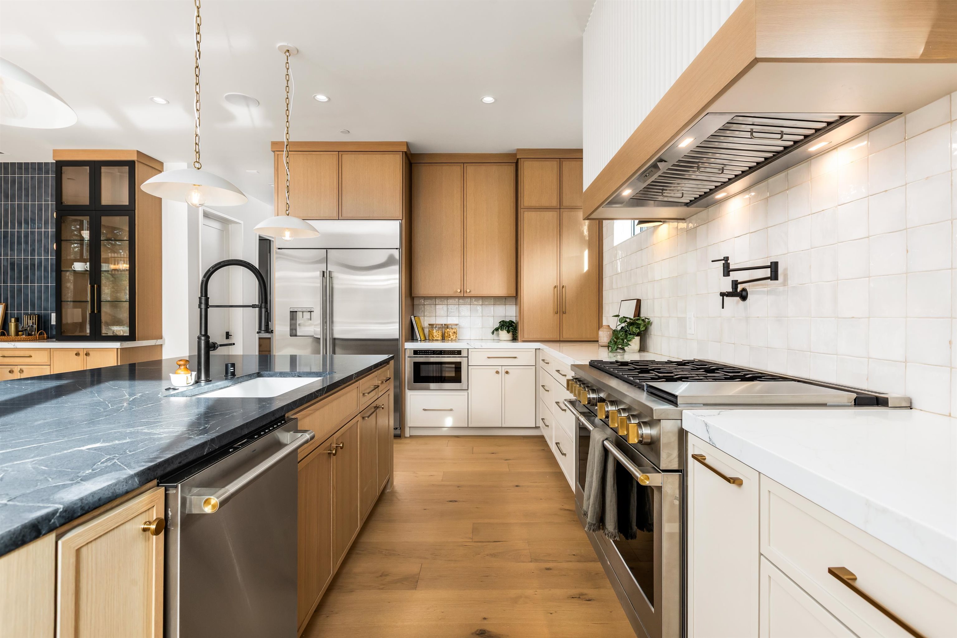 11051 Ghirard Road Truckee, CA 96161 - Photo 9 of 23 a kitchen with a stove a sink and a refrigerator