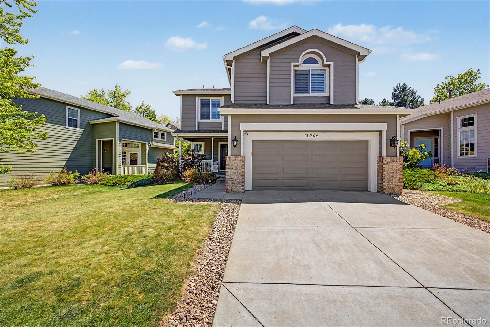 10246 South Spotted Owl Avenue Highlands Ranch, CO 80129 - Photo 1 of 49 a house view with a garden space