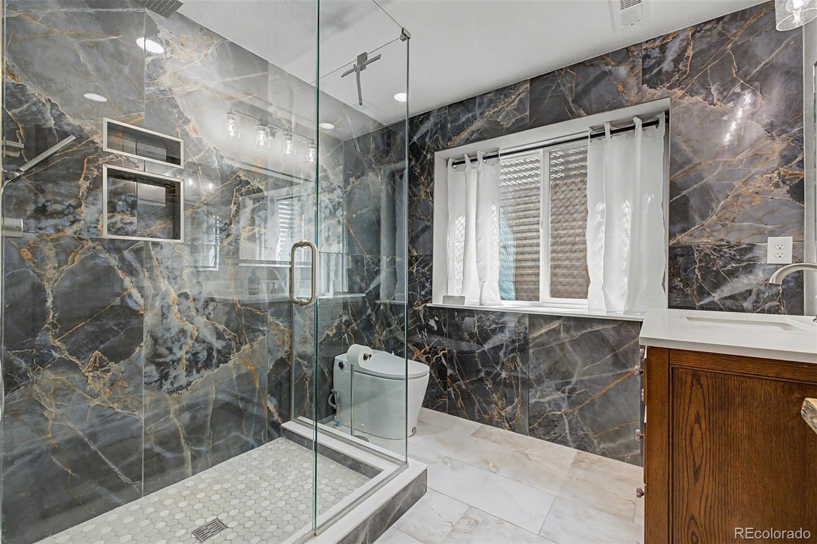 10246 South Spotted Owl Avenue Highlands Ranch, CO 80129 - Photo 25 of 49 a bathroom with shower