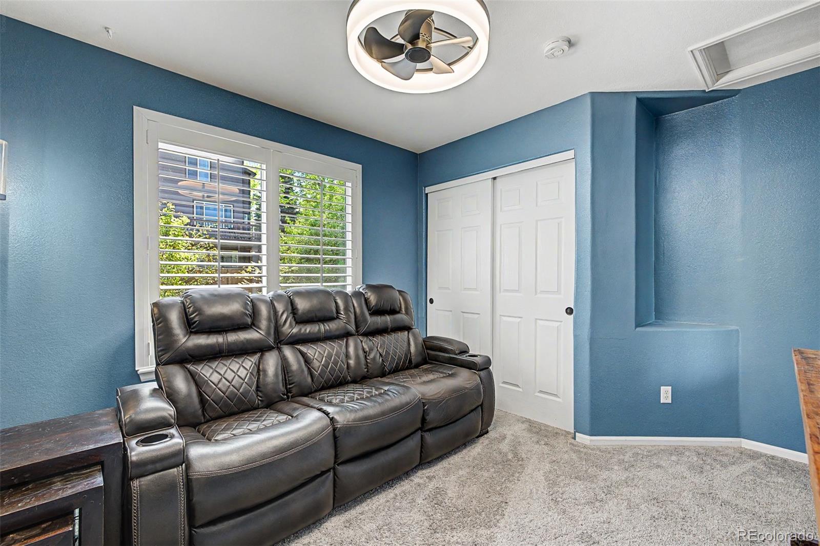 10246 South Spotted Owl Avenue Highlands Ranch, CO 80129 - Photo 36 of 49 a living room with furniture and a window