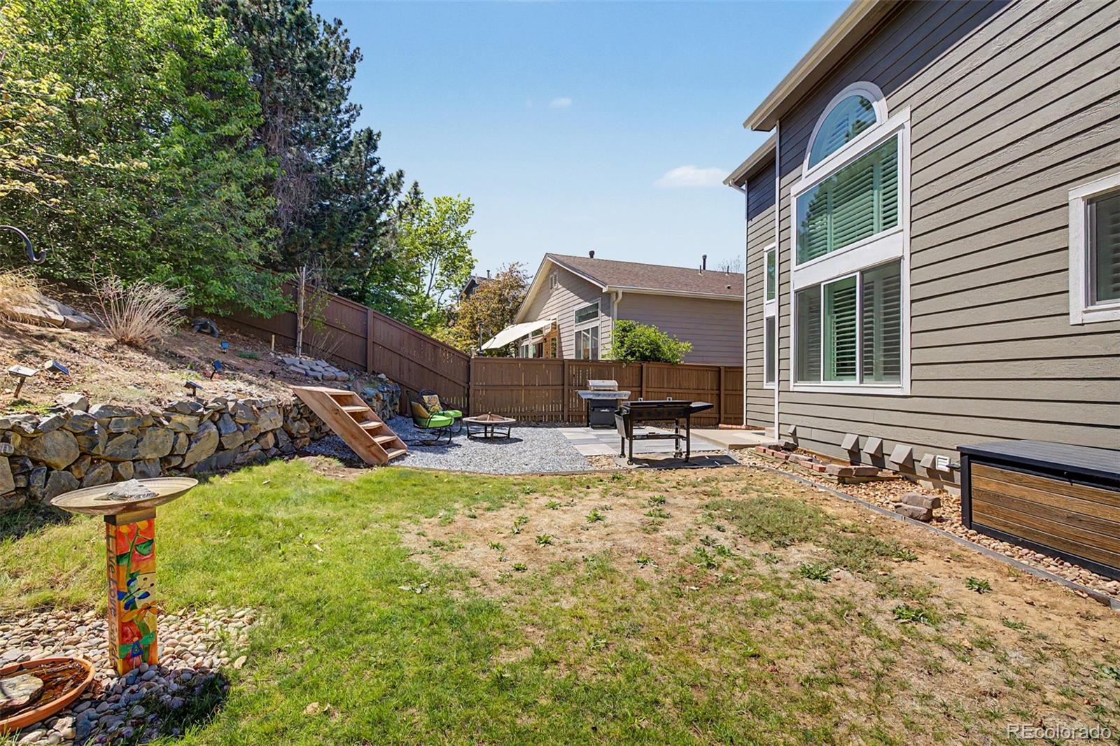 10246 South Spotted Owl Avenue Highlands Ranch, CO 80129 - Photo 42 of 49 a view of a house with backyard porch and sitting area