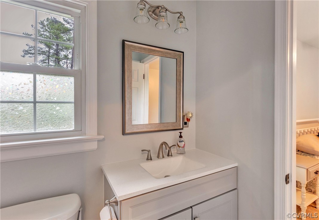4801 Wilconna Road Chesterfield, VA 23832 - Photo 15 of 25 a bathroom with a sink vanity mirror and toilet
