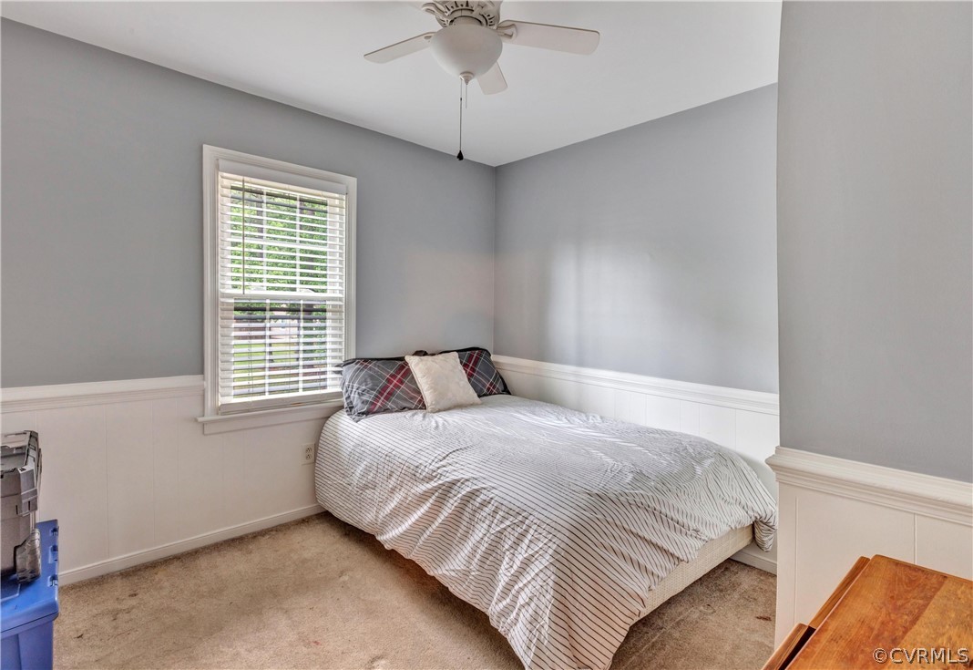 4801 Wilconna Road Chesterfield, VA 23832 - Photo 16 of 25 a bedroom with a bed and a chandelier