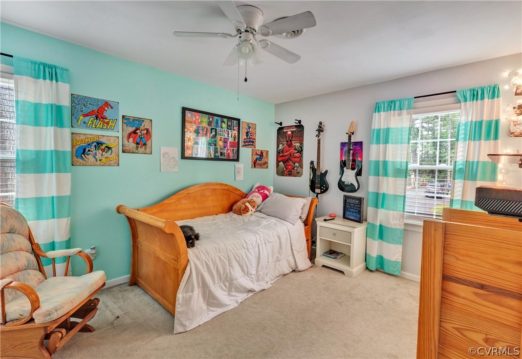 4801 Wilconna Road Chesterfield, VA 23832 - Photo 17 of 25 a bedroom with furniture and a chandelier