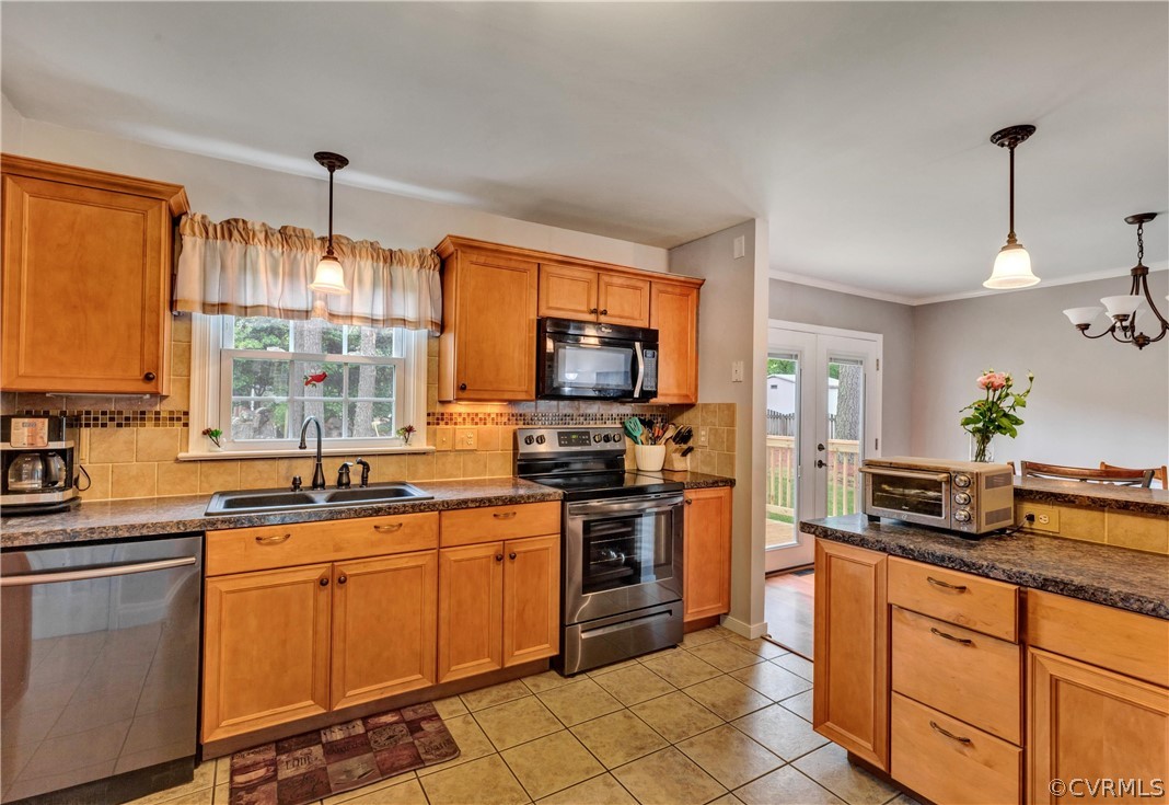 4801 Wilconna Road Chesterfield, VA 23832 - Photo 4 of 25 a kitchen with stainless steel appliances granite countertop a sink stove and refrigerator