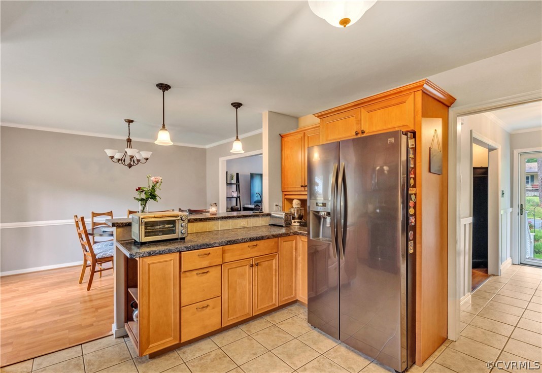 4801 Wilconna Road Chesterfield, VA 23832 - Photo 5 of 25 a kitchen with stainless steel appliances a refrigerator and a table