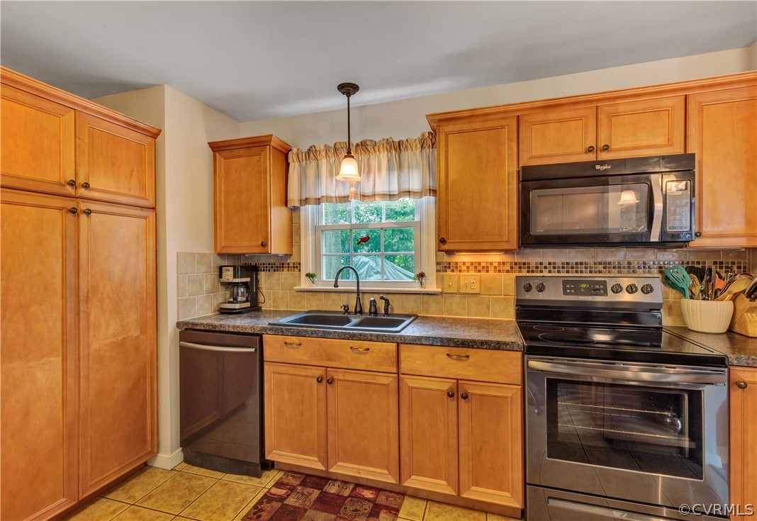 4801 Wilconna Road Chesterfield, VA 23832 - Photo 6 of 25 a kitchen with stainless steel appliances a stove sink and microwave