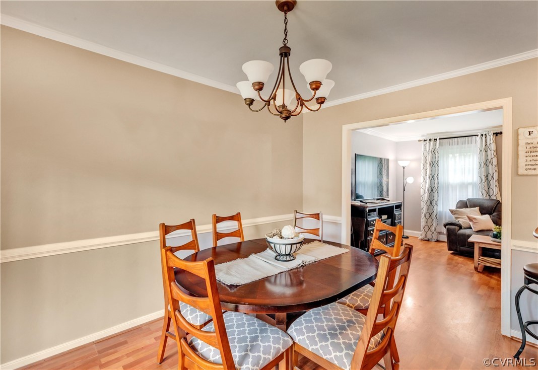 4801 Wilconna Road Chesterfield, VA 23832 - Photo 7 of 25 a view of a dining room with furniture wooden floor and chandelier