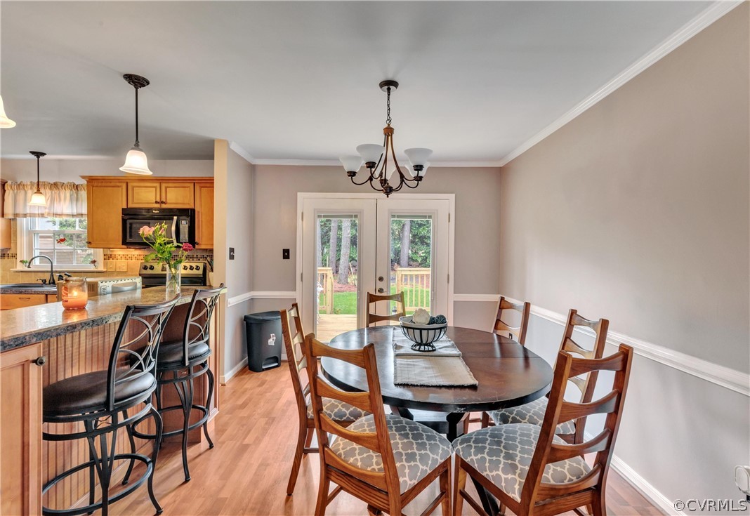 4801 Wilconna Road Chesterfield, VA 23832 - Photo 9 of 25 a view of a dining room with furniture window and outside view