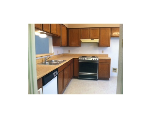 2809 St Joseph Street, Unit B Corpus Christi, TX 78418 - Photo 2 of 5 a kitchen with stainless steel appliances granite countertop a sink and a stove