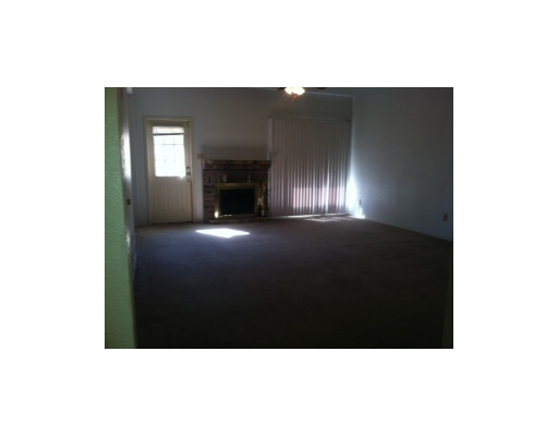 2809 St Joseph Street, Unit B Corpus Christi, TX 78418 - Photo 3 of 5 a view of an empty room with a fireplace