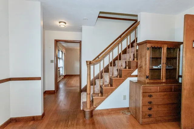 a view of staircase with wooden floor and stairs