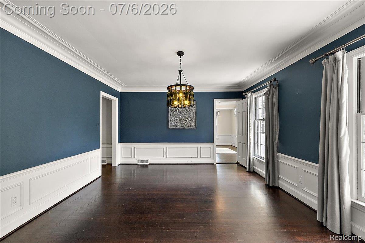 1051 Devonshire Road Grosse Pointe, MI 48230 - Photo 20 of 98 Spacious room featuring dark wood-finish flooring, white wainscoting, and crown molding