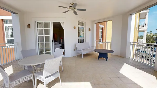 a living room with furniture a table and a window