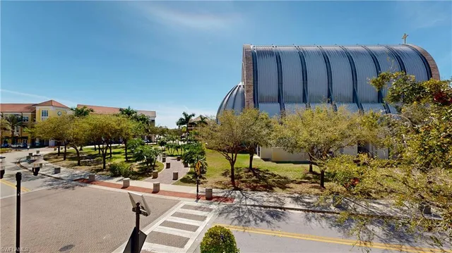 a view of a chairs and table in the backyard
