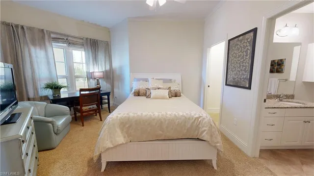 a bedroom with two beds and a flat screen tv