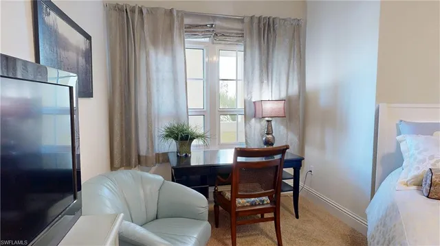 a bathroom with a granite countertop toilet sink and mirror