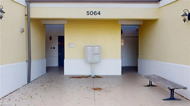 a view of a swimming pool with outdoor seating