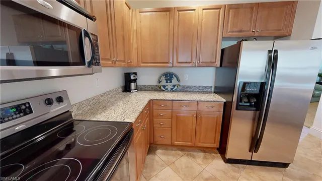 a kitchen with a stove microwave and sink