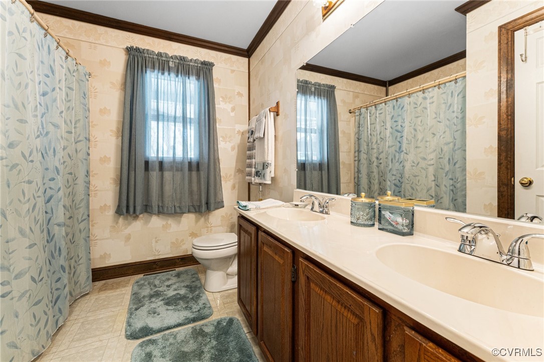 16287 Derby Ridge Road Montpelier, VA 23192 - Photo 25 of 50 Bathroom featuring wallpapered walls, a sink, orna
