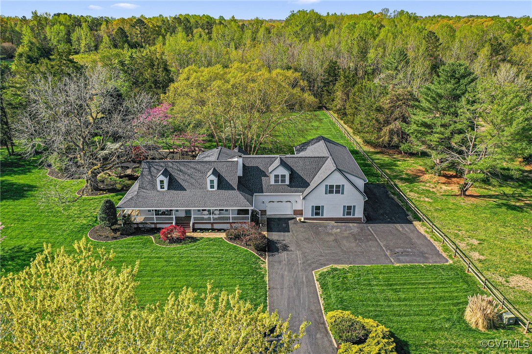 Bird's eye view featuring a wooded view