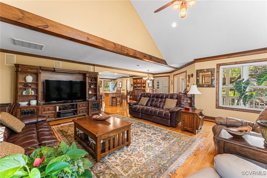 16287 Derby Ridge Road Montpelier, VA 23192 - Photo 37 of 50 Living room with ceiling fan with notable chandeli