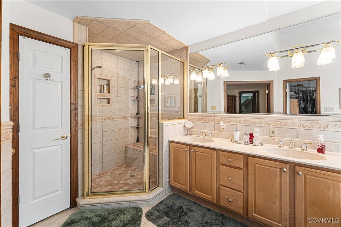 16287 Derby Ridge Road Montpelier, VA 23192 - Photo 44 of 50 Full bathroom with a shower stall, a sink, and til