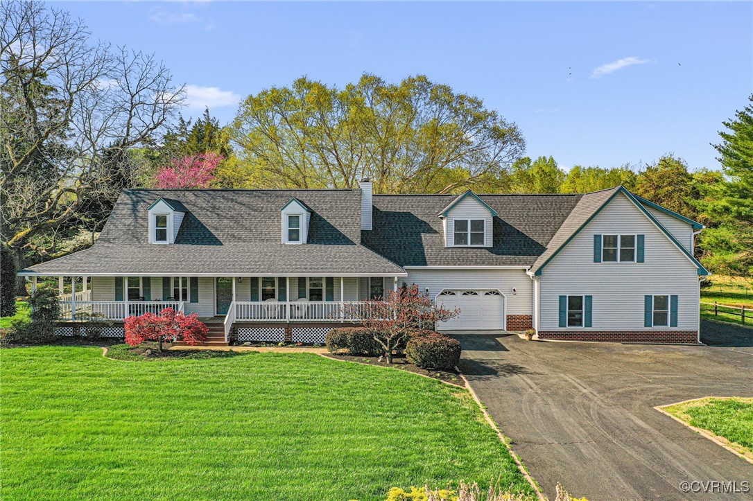 View of front facade featuring a shingled roof, ap