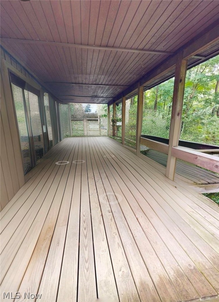 2868 Shade Road Akron, OH 44333 - Photo 44 of 49 Expansive covered deck featuring a wood plank floor and ceiling