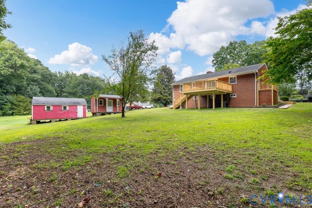 3308 Sylvania Road Chester, VA 23831 - Photo 47 of 55 Expansive green lawn with a red brick exterior, a