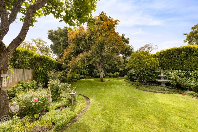 a view of a swimming pool with an outdoor space and seating area