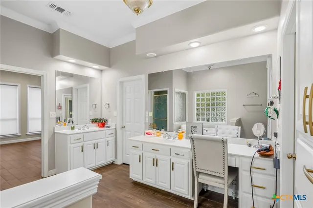 a en suite bathroom with a sink a mirror and a shower