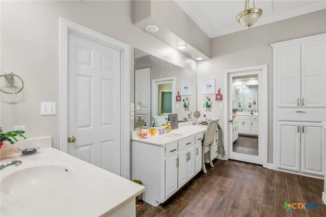 a bathroom with a sink and a mirror