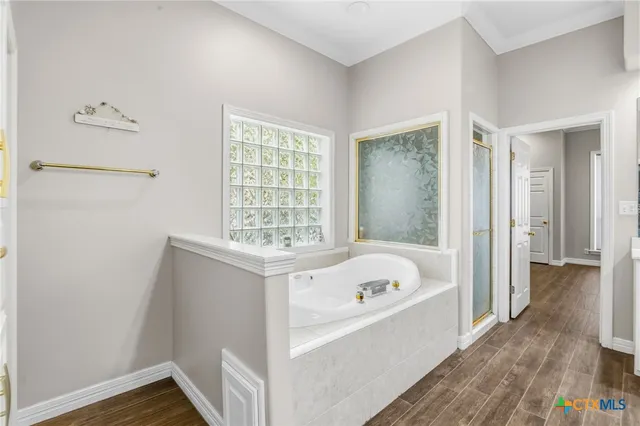 a bathroom with a toilet sink and shower