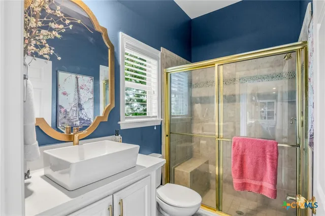 an aerial view of a swimming pool patio and outdoor seating