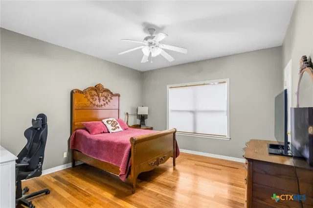 an aerial view of a house with garden space and swimming pool