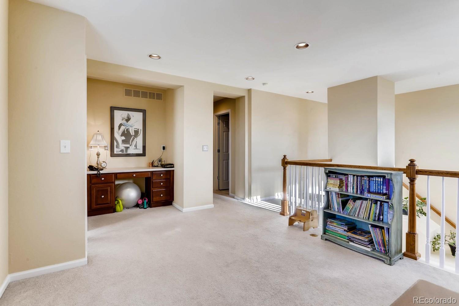 10825 Towerbridge Road Highlands Ranch, CO 80130 - Photo 21 of 24 a view of an empty room with workspace and a window