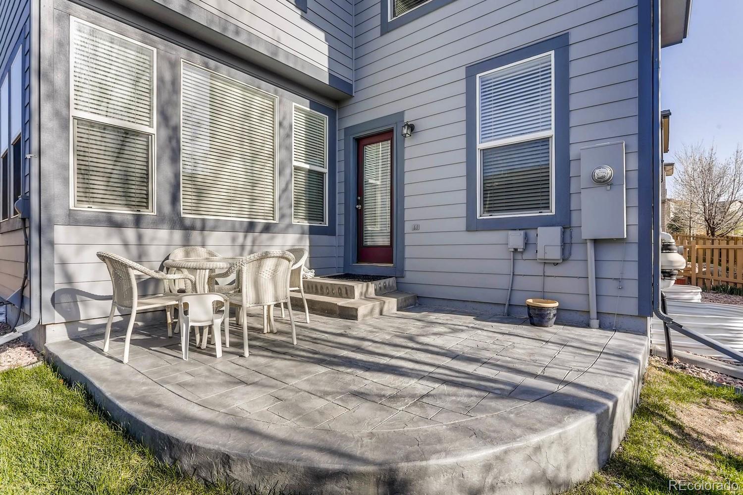 10825 Towerbridge Road Highlands Ranch, CO 80130 - Photo 22 of 24 a view of house with outdoor seating space