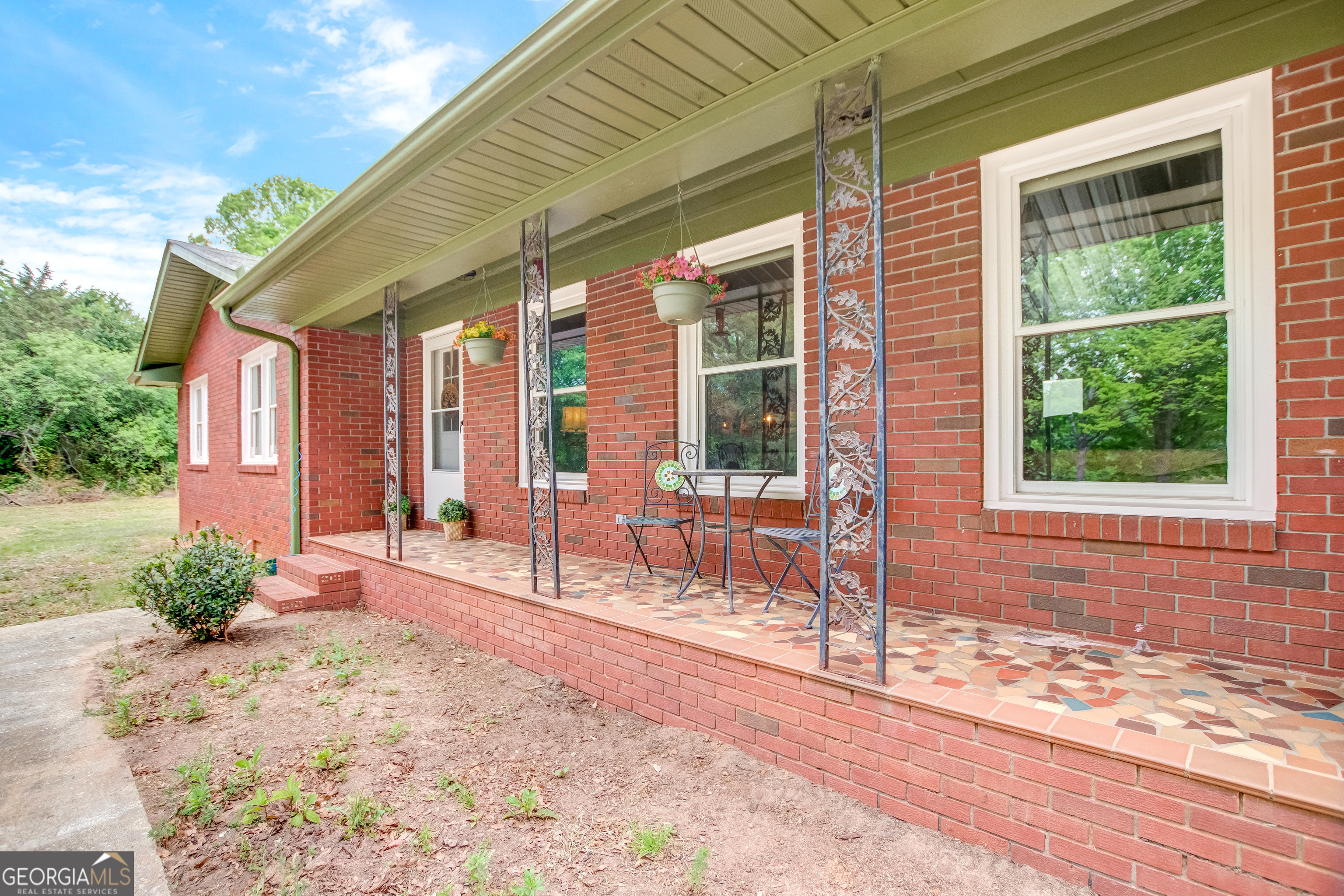 127 Akins Bridge Road Eastanollee, GA 30538 - Photo 15 of 52 a front view of a house with a outdoor seating