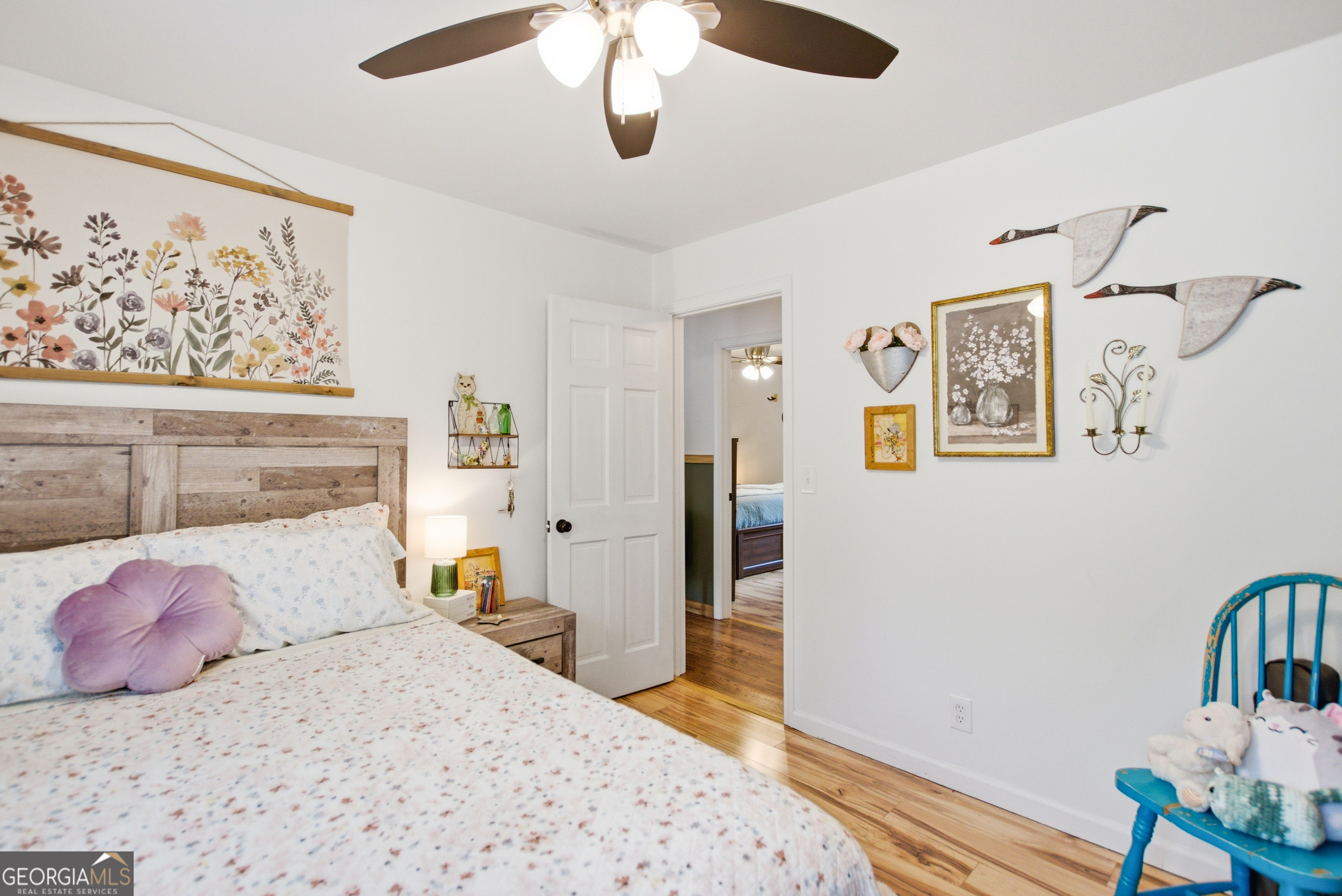 127 Akins Bridge Road Eastanollee, GA 30538 - Photo 39 of 52 a bedroom with a bed and wooden floor